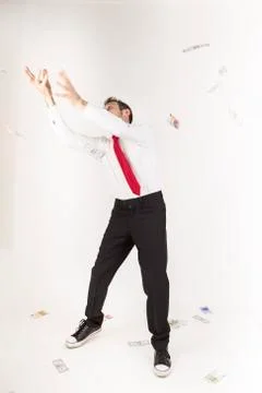Rain of banknotes on a young manager Stock Photos