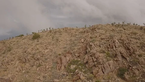 Rain behind desert mountain Stock-Footage 86477915