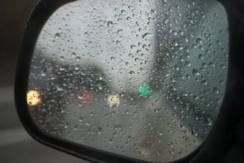 Rain behind a window. rain drops on glass. cars on the road. heavy rain Stock Photos