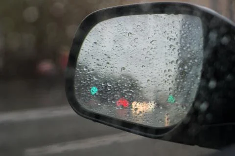 Rain behind a window. rain drops on glass. cars on the road. heavy rain Stock Photos