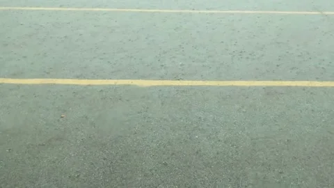 Rain Bouncing off of the Pavement Stock Footage 145991838