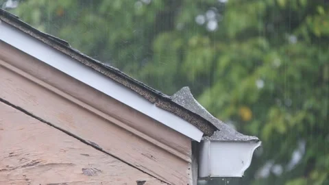 Rain bouncing off a roof top. Stock Footage 318943440