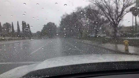 Rain Car Front View Driving in Street Stockbeeldmateriaal 102928250
