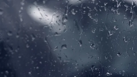Rain on a car window dripping down in slow motion Stock Footage 77938748