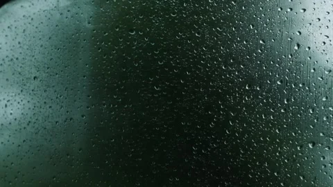 Rain on the car window glass. Up close Slow motion. Rain on the glass. Rain Stock Footage 262973308
