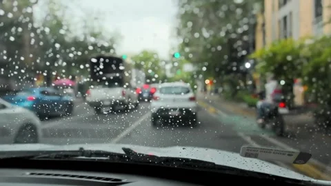 Rain On Car Windshield With Blurred Urban Street Traffic In Mexico City Stock Footage 344885125