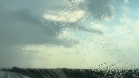Rain On Car Windshield With Wipers On Rural Road Stock Footage 346538572