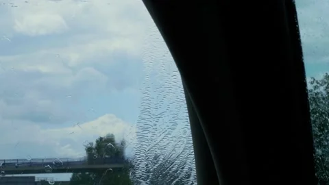 Rain ceasing during car driving with working windscreen wipers Stock Footage 131257737