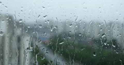 Rain in city, closeup on raindrops on window Vídeo Stock 154848926