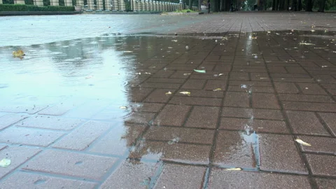 Rain in city sidewalk in 4K. Stock Footage 141325468