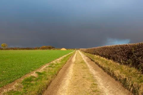 Rain cloud over bridleway Stock Photos