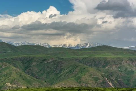 Rain cloud over the mountains. Stock Photos