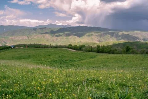 Rain cloud over the mountains. Stock Photos