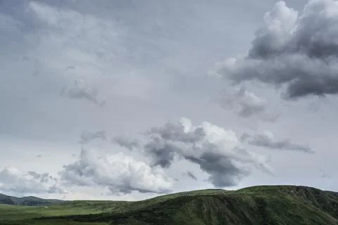 Rain cloud over the mountains. Stock Photos