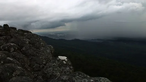 The rain cloud raining over the tropical mountain at Phu Hin Rong Kla Nationa Stock Footage 82413473