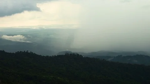 The rain cloud raining over the tropical mountain at Phu Hin Rong Kla Nationa Stock Footage 83559184