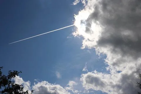 Rain cloud with a ray on blue sky Stock Photos