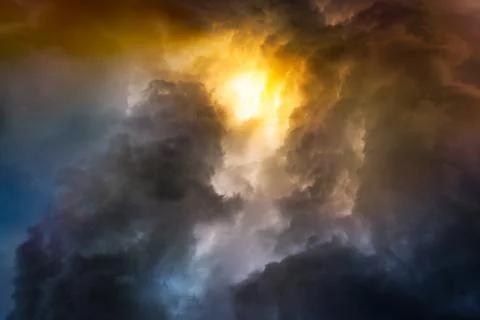 Rain cloud on sunset Stock Photos