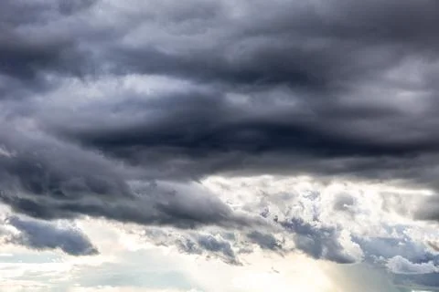 Rain cloud. Weather change. Different climatic situations in a single image. 写真素材