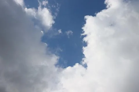 Rain clouds against blue sky Stock Photos