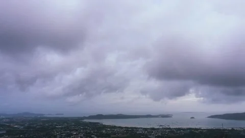 Rain clouds are flowing with strong winds on a city near the sea Stock Footage 205260453