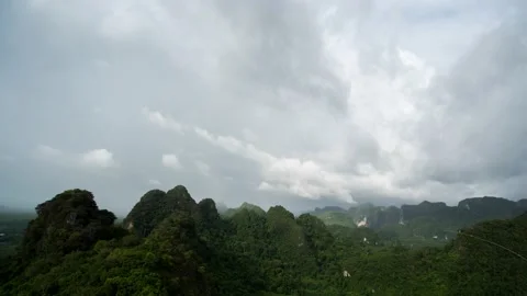 Rain clouds are moving along a large mountain Video stock 205260715