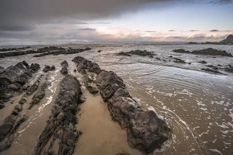 Rain clouds coming from the Atlantic on to Cornish beach Foto stock