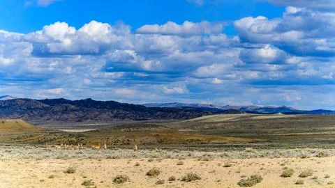 Rain clouds during the day over the plains in Utah, USA Foto stock