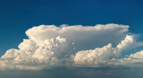 Rain clouds forming on blue Florida sky. Colorful summer skyscape 写真素材
