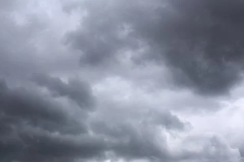 Rain clouds forming in the sky in concept of climate. Stock Photos