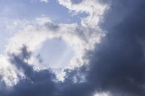 Rain clouds in mid day on blue sky Stockfoto's