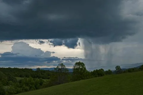 Rain clouds in mountain landscape Stock Photos