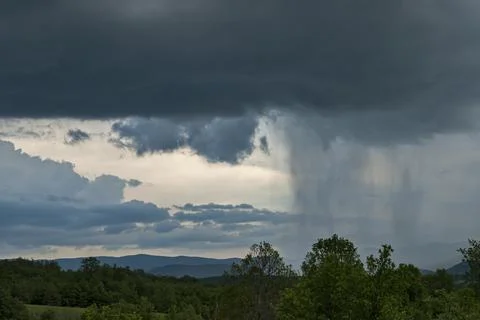 Rain clouds in mountain landscape Stock Photos