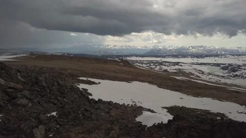 Rain clouds with mountains in the distance Stock Footage 166298783