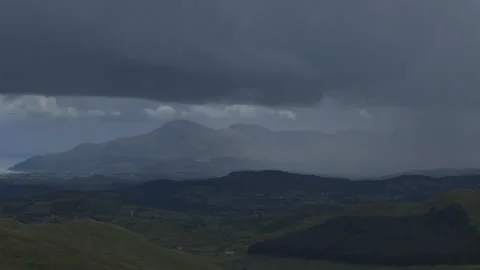 Rain clouds move across a mountain landscape time lapse Video stock 140737088