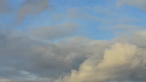 Rain Clouds moving across a blue sky (timelapse) Stock Footage 12564593