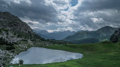 Rain clouds moving over the lake and mountains Stock Footage 115655041