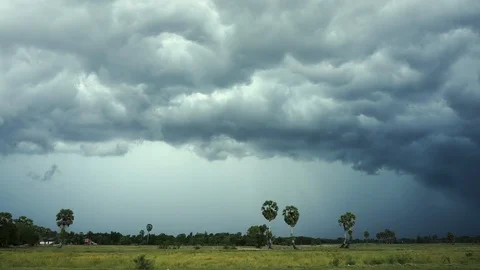 Rain clouds moving slow with flash of lightning on the left side. View of the Stock Footage 92511629