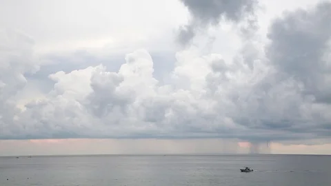 Rain Clouds Over Atlantic Ocean with Boat Passing Stock Footage 76767229