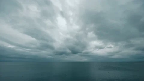 Rain clouds over the calm sea Stock Footage 239090122