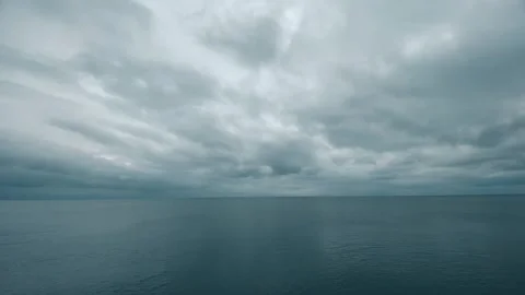 Rain clouds over the calm sea Stock Footage 242315112