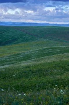 Rain clouds over distant hills at sunset. Foto stock