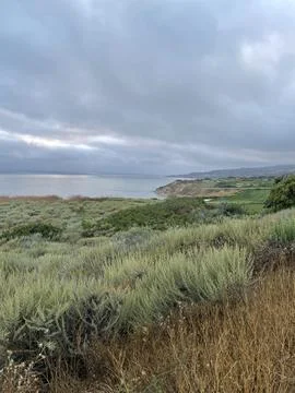 Rain Clouds Over Golf Course Cliffside on the Pacific Ocean in California Stock Photos