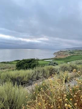 Rain Clouds Over Golf Course Cliffside on the Pacific Ocean in California Stock Photos