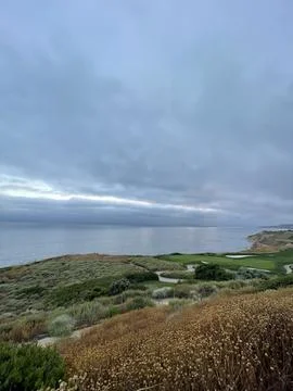 Rain Clouds Over Golf Course Cliffside on the Pacific Ocean in California Stock Photos