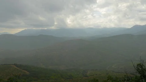Rain clouds over the green mountains Stock Footage 79443625