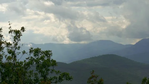 Rain clouds over mountains, time lapse Stock Footage 79447341