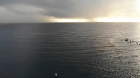 Rain clouds over the ocean and boats 4k aerial. Stock Footage 107441754