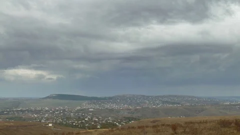 Rain clouds over small town, time lapse Video stock 81373476