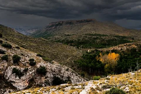 Rain clouds over the table mountains in the Aliaga desert in Spain Stock Photos